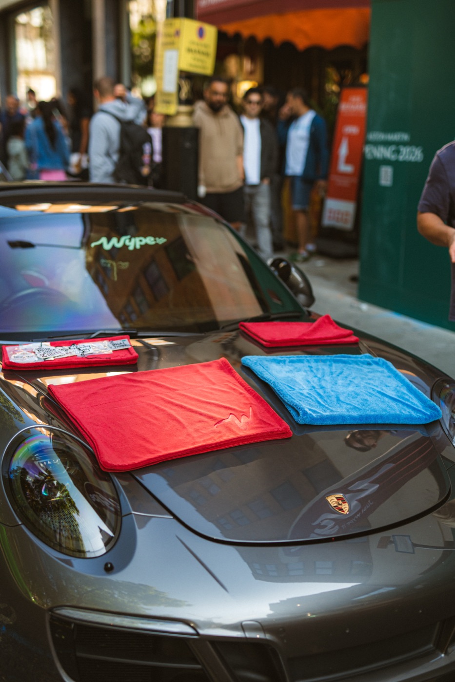 wype towels laid out on the bonnet of a Porsche 911 in Mayfair