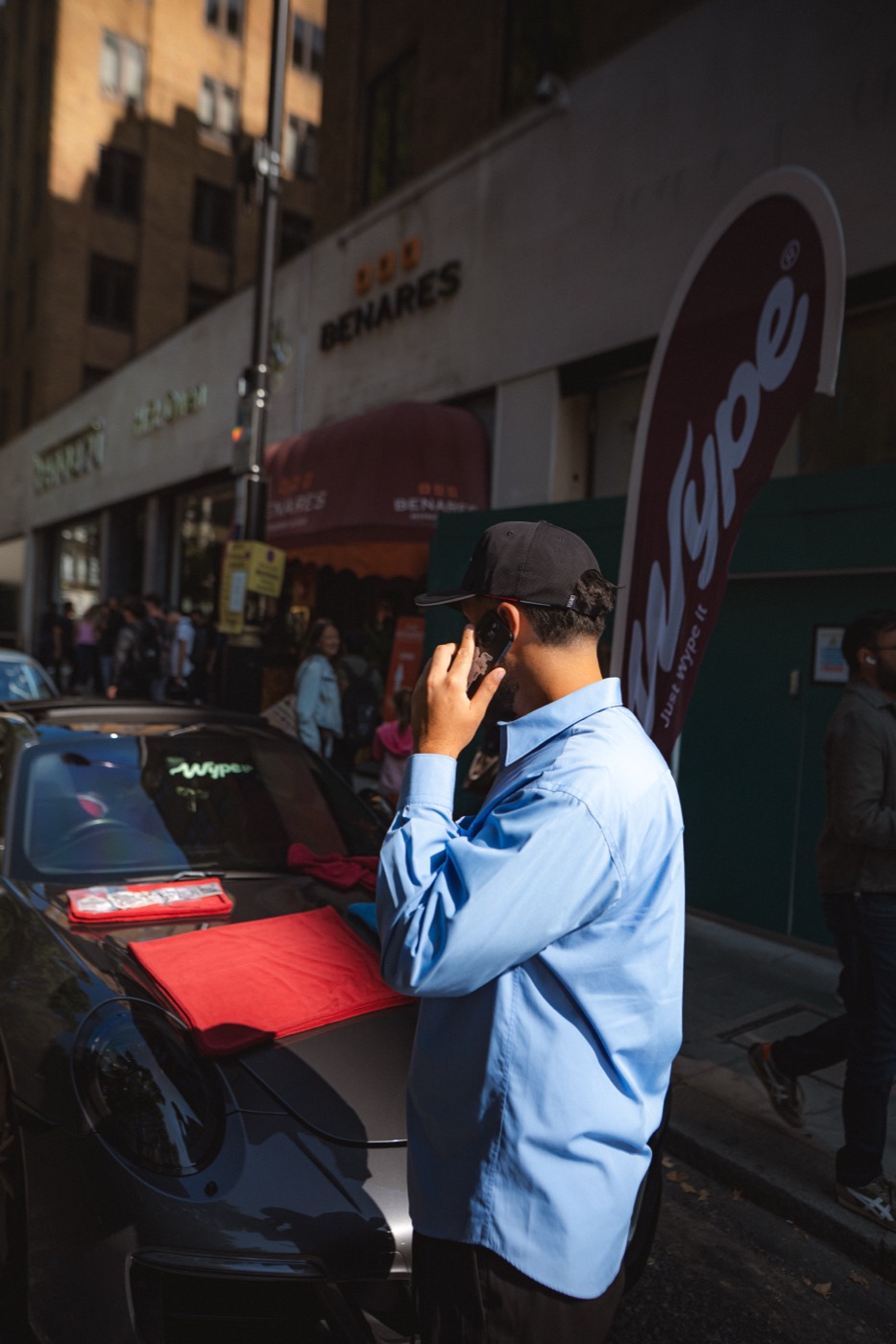 wype founder beside the wype flag and a Porsche 911 in Mayfair