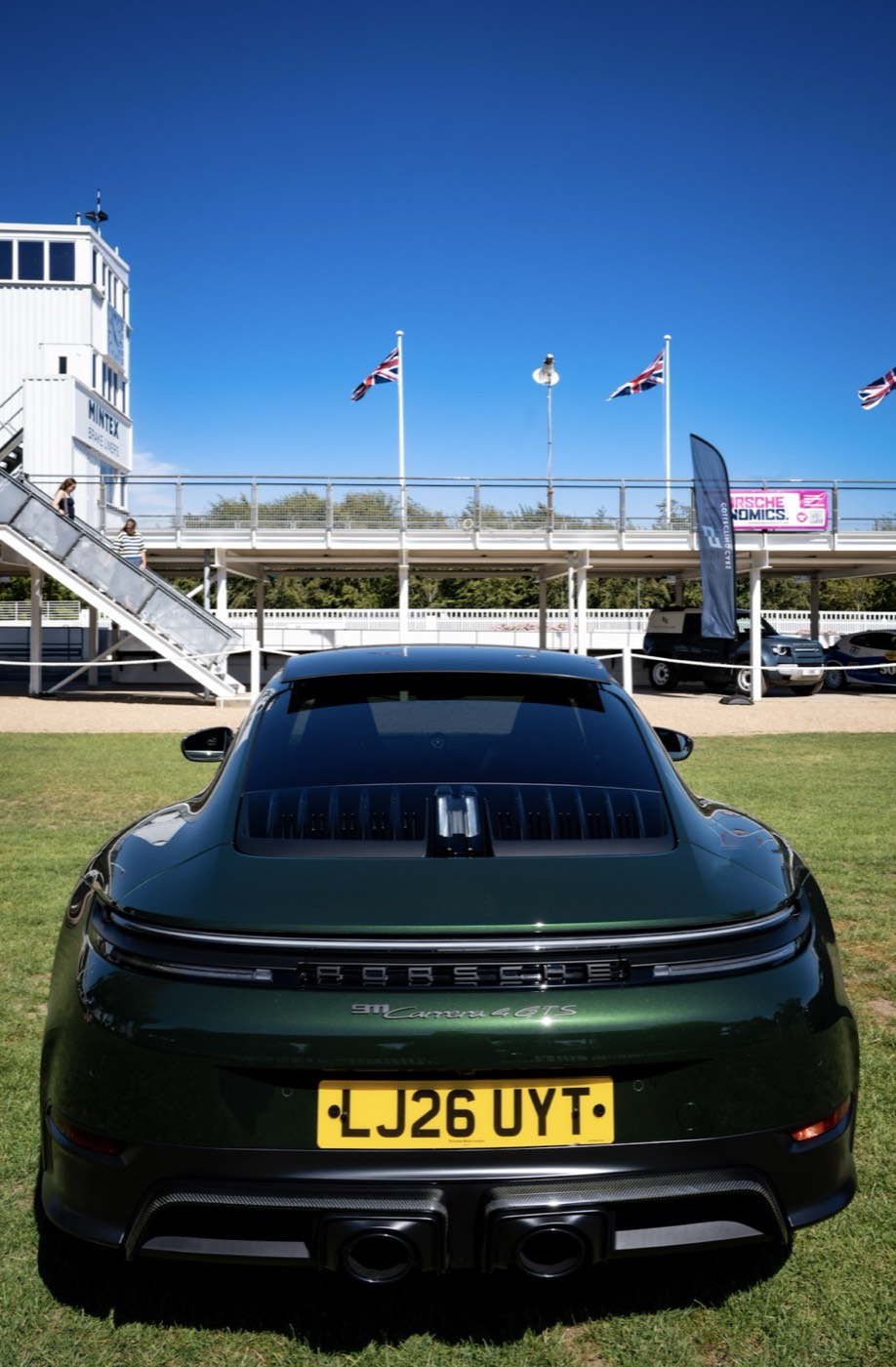 Green Porsche 911 Carrera 4 GTS at the Goodwood grandstand